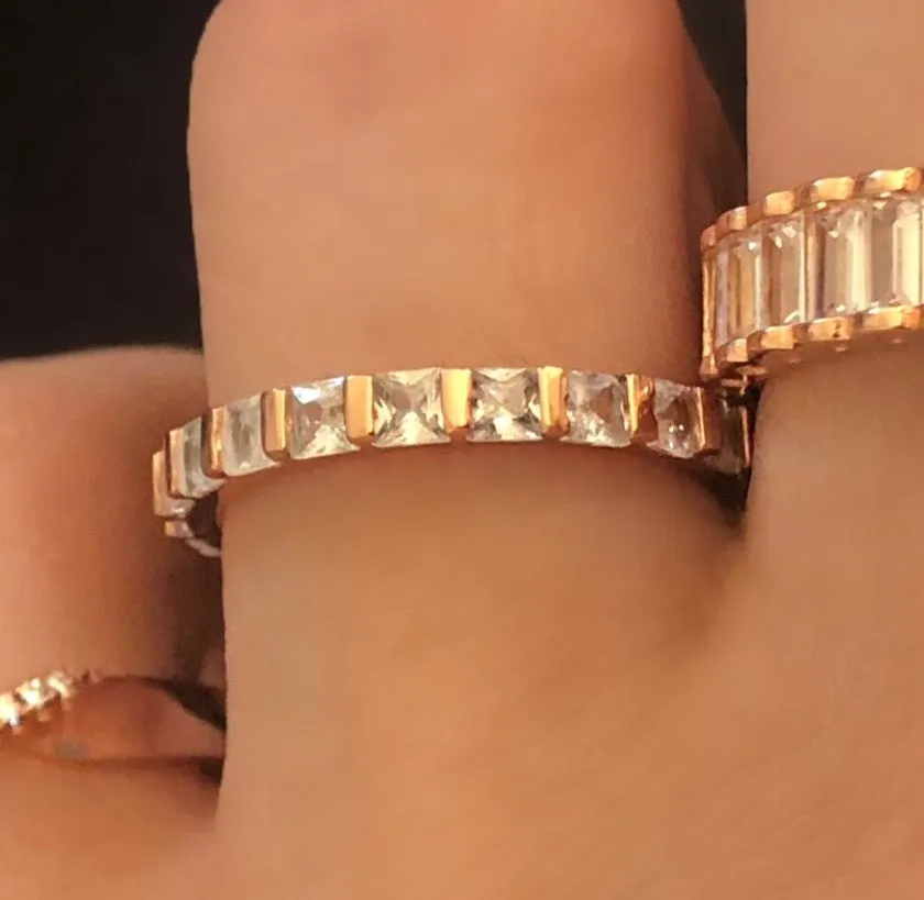 Pave-set ring with square cut clear zircon stones.